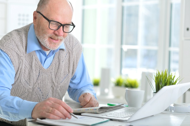 Older man working on computer